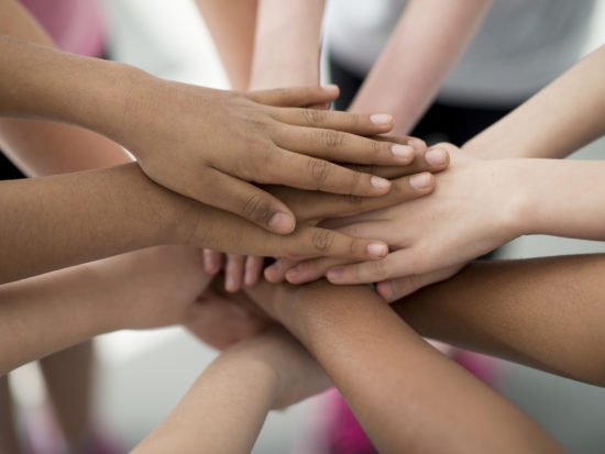 Hands Together in a Huddle