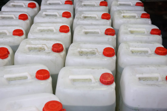 Plastic jugs of chemicals