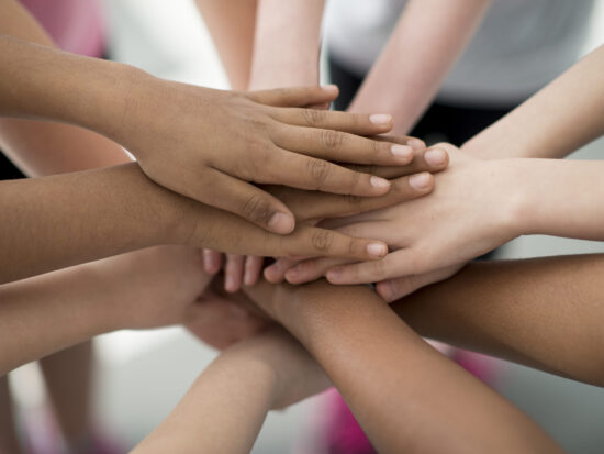 Hands Together in a Huddle