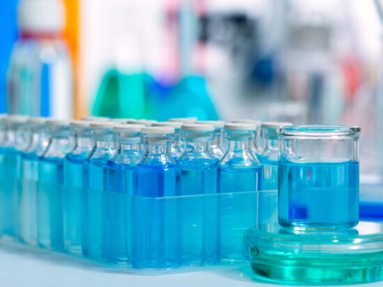 Biotechnology Chemical scientific laboratory with blue glass bottles