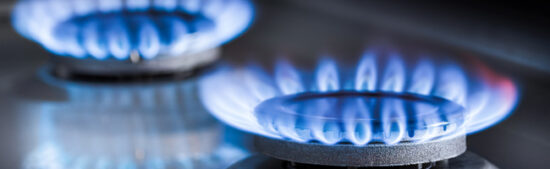 Two,Burning,Gas,Burners,On,A,Kitchen,Gas,Stove