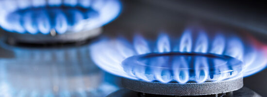 Two,Burning,Gas,Burners,On,A,Kitchen,Gas,Stove