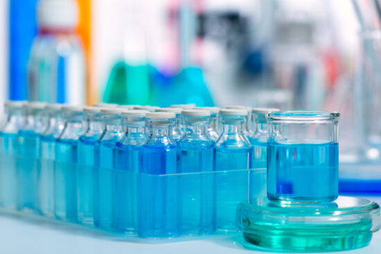 Biotechnology Chemical scientific laboratory with blue glass bottles