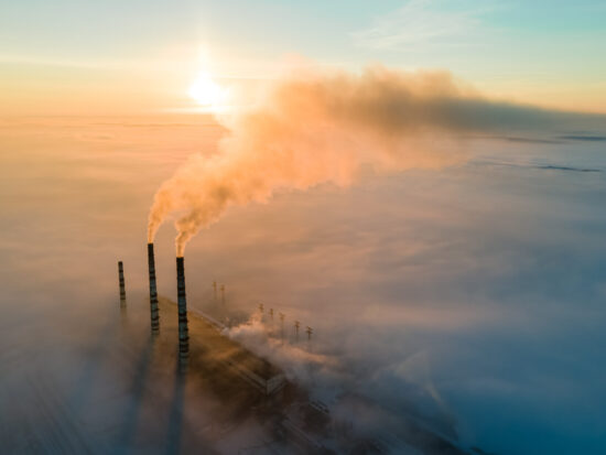 Aerial,View,Of,Coal,Power,Plant,High,Pipes,With,Black