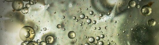 Beautiful and fantastic macro photo of water droplets in oil with a clear background.
