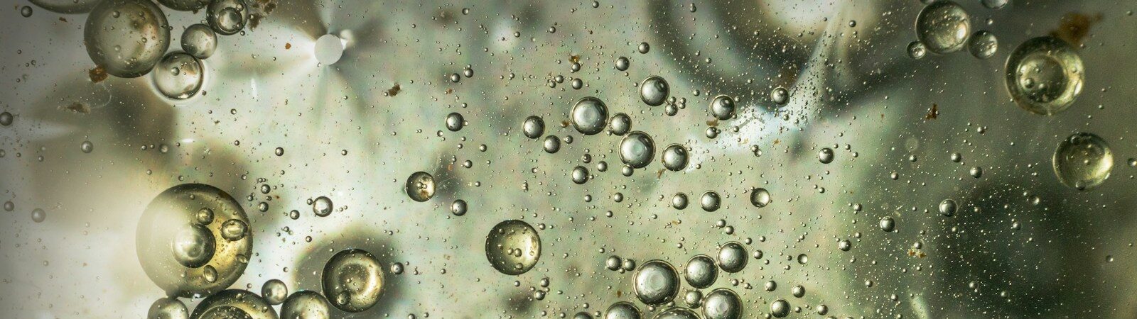 Beautiful and fantastic macro photo of water droplets in oil with a clear background.