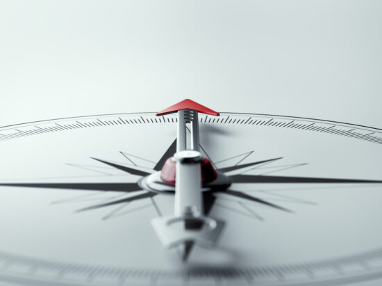 Compass on White Background with Selective Focus