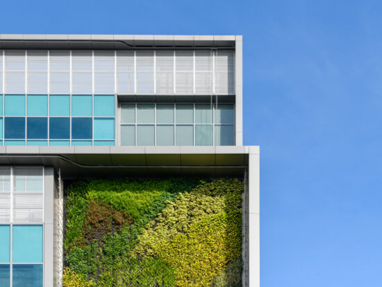 Modern green building with innovative high rise vertical garden