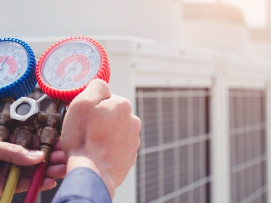 technician checking air conditioner