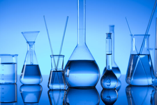 GettyImages-936335520_Science concept. Laboratory glassware. Chemical experiment. Blue background