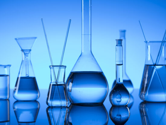 GettyImages-936335520_Science concept. Laboratory glassware. Chemical experiment. Blue background