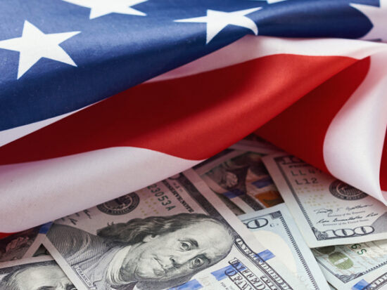 USA national flag and dollar bills. Business and finance concept